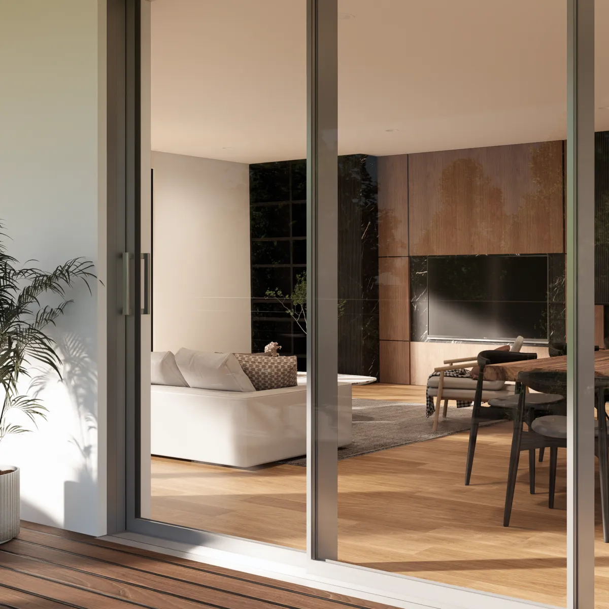 Living room with sliding glass doors opening onto a timber deck